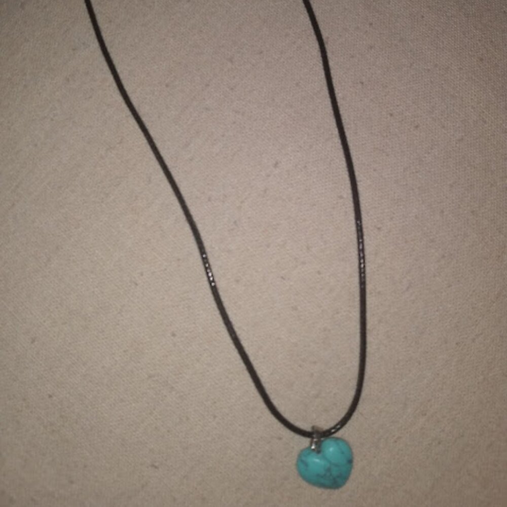 Turquoise color heart shaped stone pendant necklace.